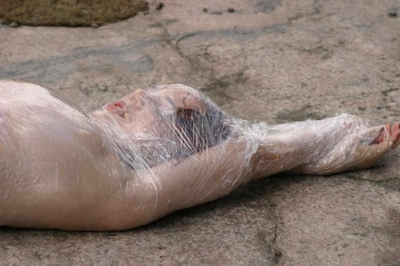 20P Girl tied up outdoors with plastic wrap