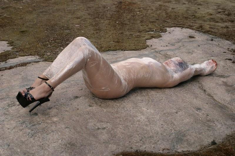20P Girl tied up outdoors with plastic wrap