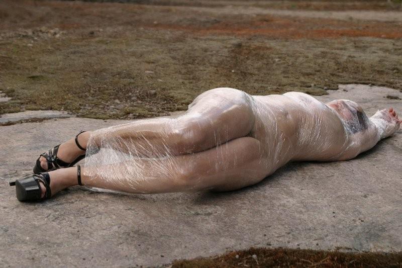 20P Girl tied up outdoors with plastic wrap