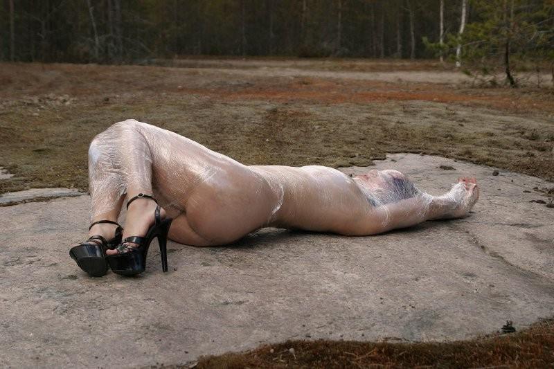 20P Girl tied up outdoors with plastic wrap