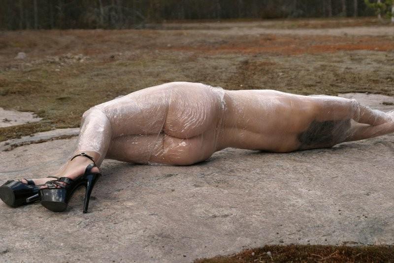 20P Girl tied up outdoors with plastic wrap