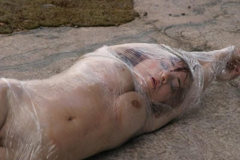 20P Girl tied up outdoors with plastic wrap