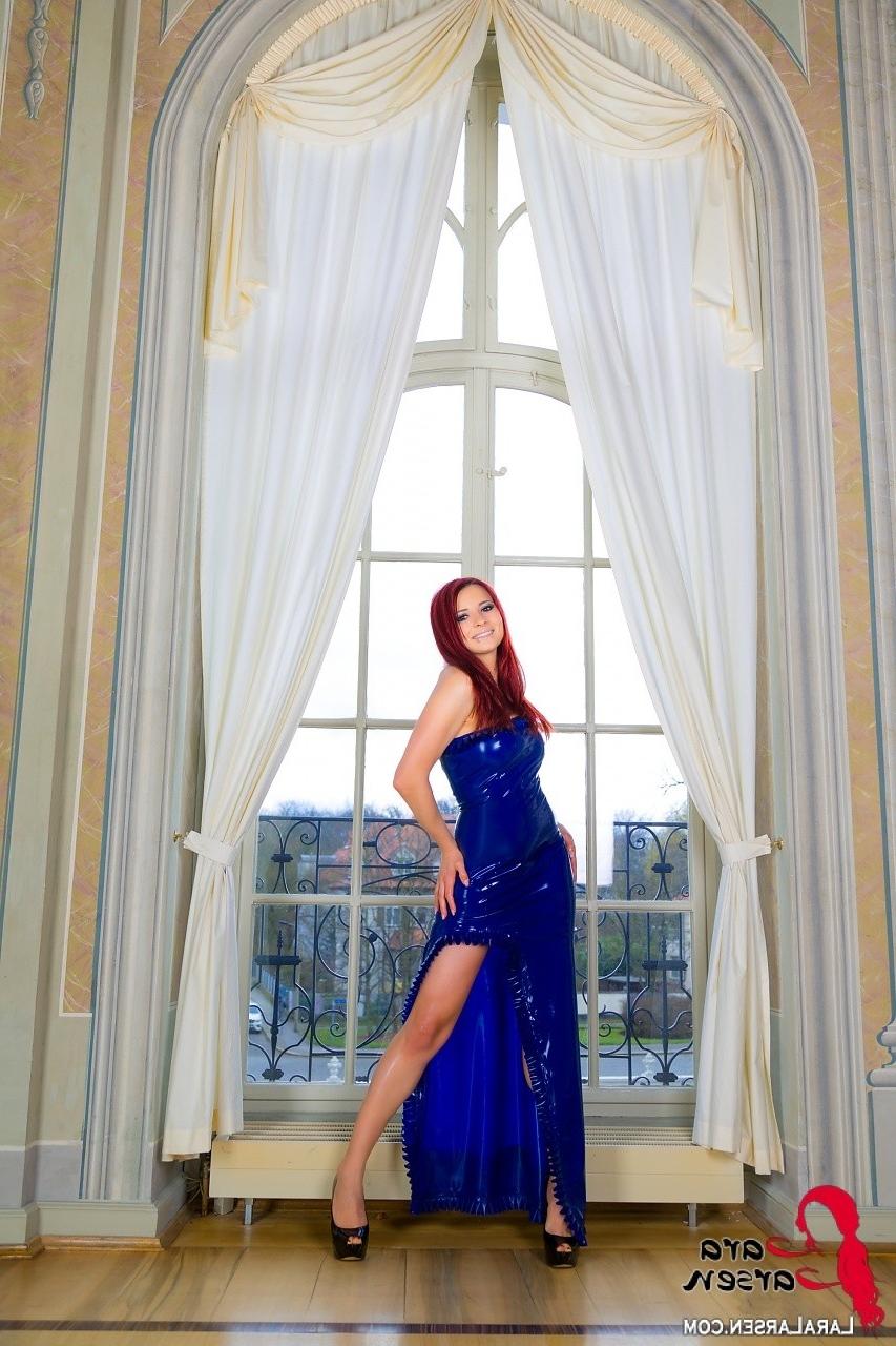 12P Redhead in latex dress