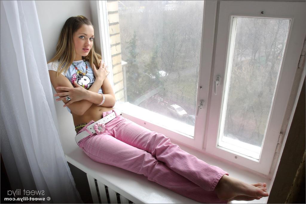 12P Delicious Russian teen Sweet Lilya is nude in a window