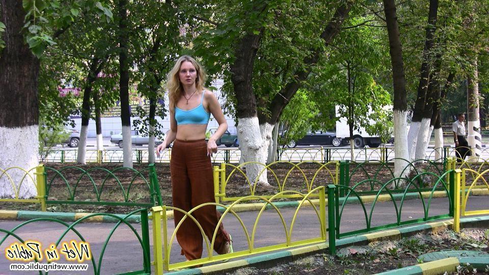 16P Blonde addicted to public pissing makes her pants all wet in a park