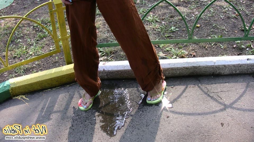 16P Blonde addicted to public pissing makes her pants all wet in a park