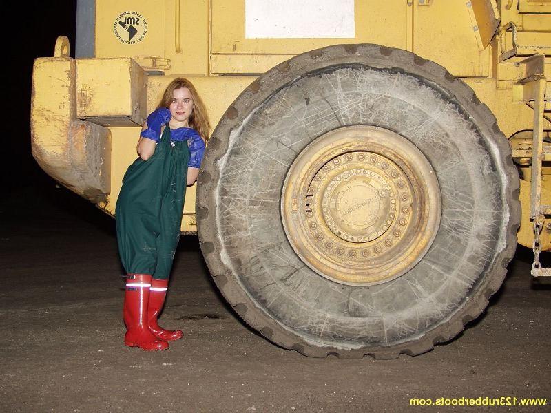 20P Hot babe outdoors in rubber boots and rainwear