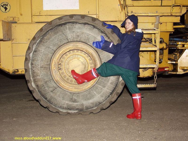 20P Hot babe outdoors in rubber boots and rainwear