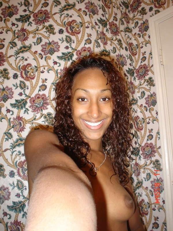 14P Horny black teen poses naked and shows close-ups of her pussy