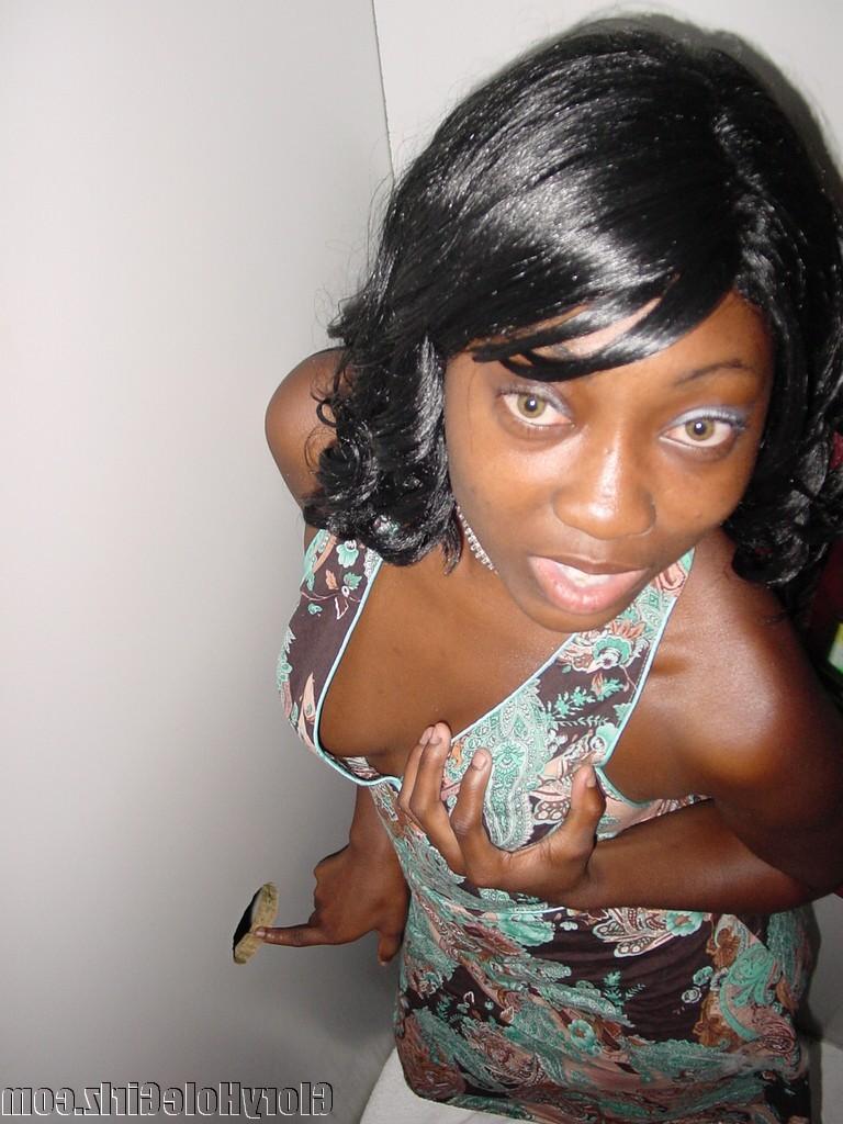 20P Ebony slut sucking and stroking strangers cocks at gloryhole