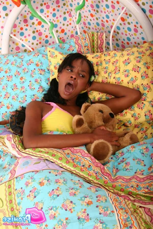 16P Cute ebony teen wakes up and strips on the bed