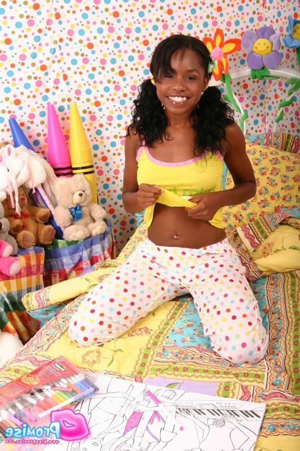 16P Cute ebony teen wakes up and strips on the bed