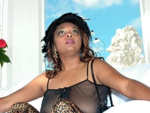 20P Big tit ebony bbw loves strip teasing and posing on a couch