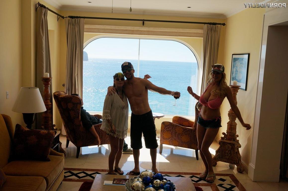 16P Kelly Madison shows off her big tits during a beach vacation