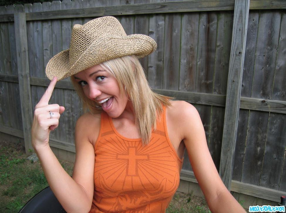 15P Amateur Foxy Jacky riding lawn mower in cowboy hat