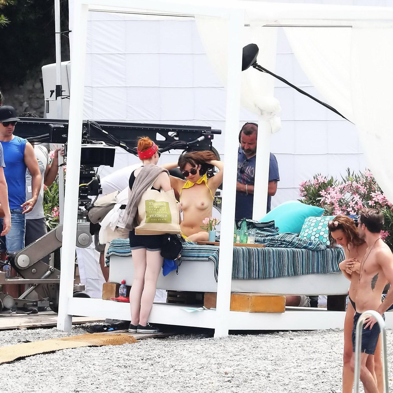 16P Dakota Johnson topless at the beach during a movie set