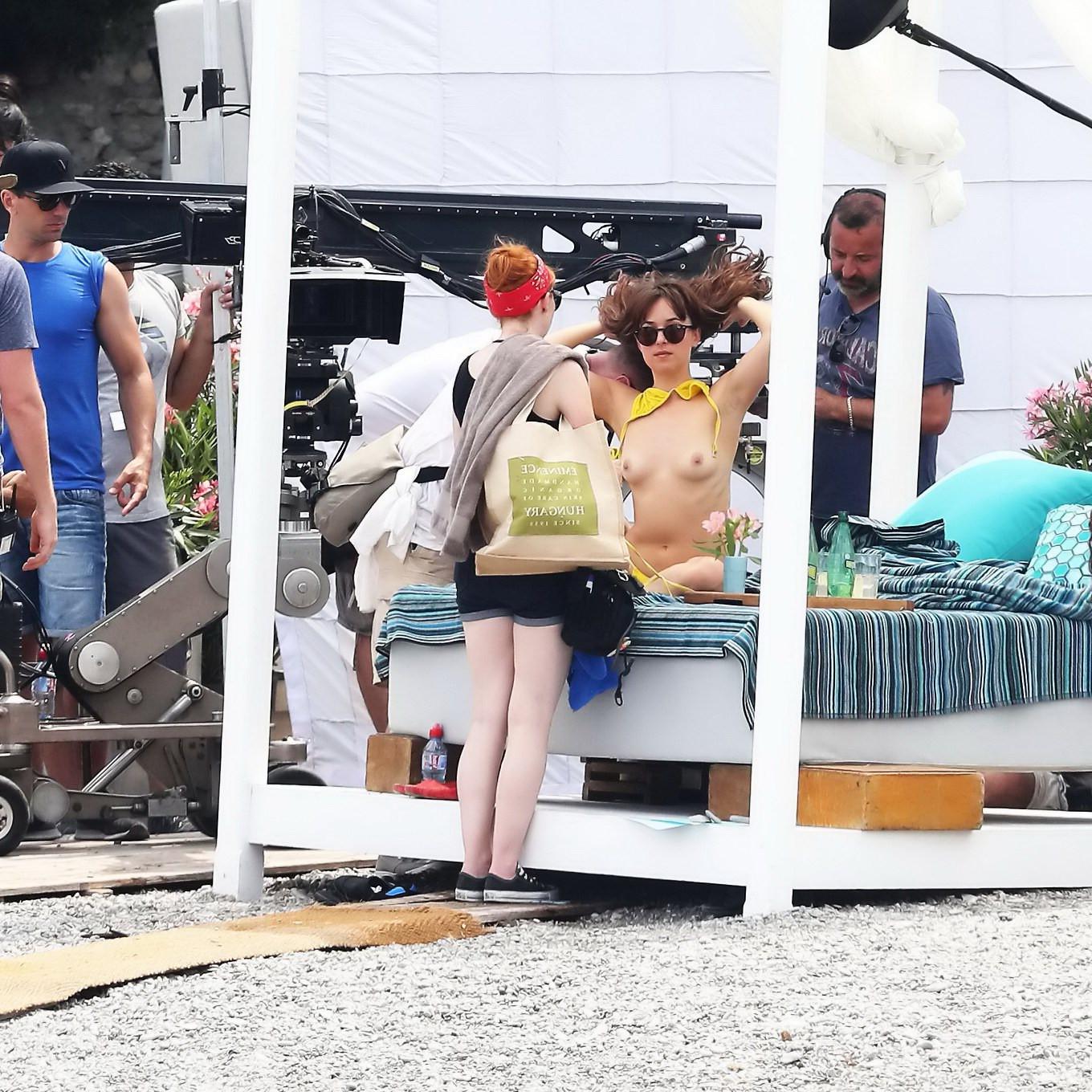16P Dakota Johnson topless at the beach during a movie set