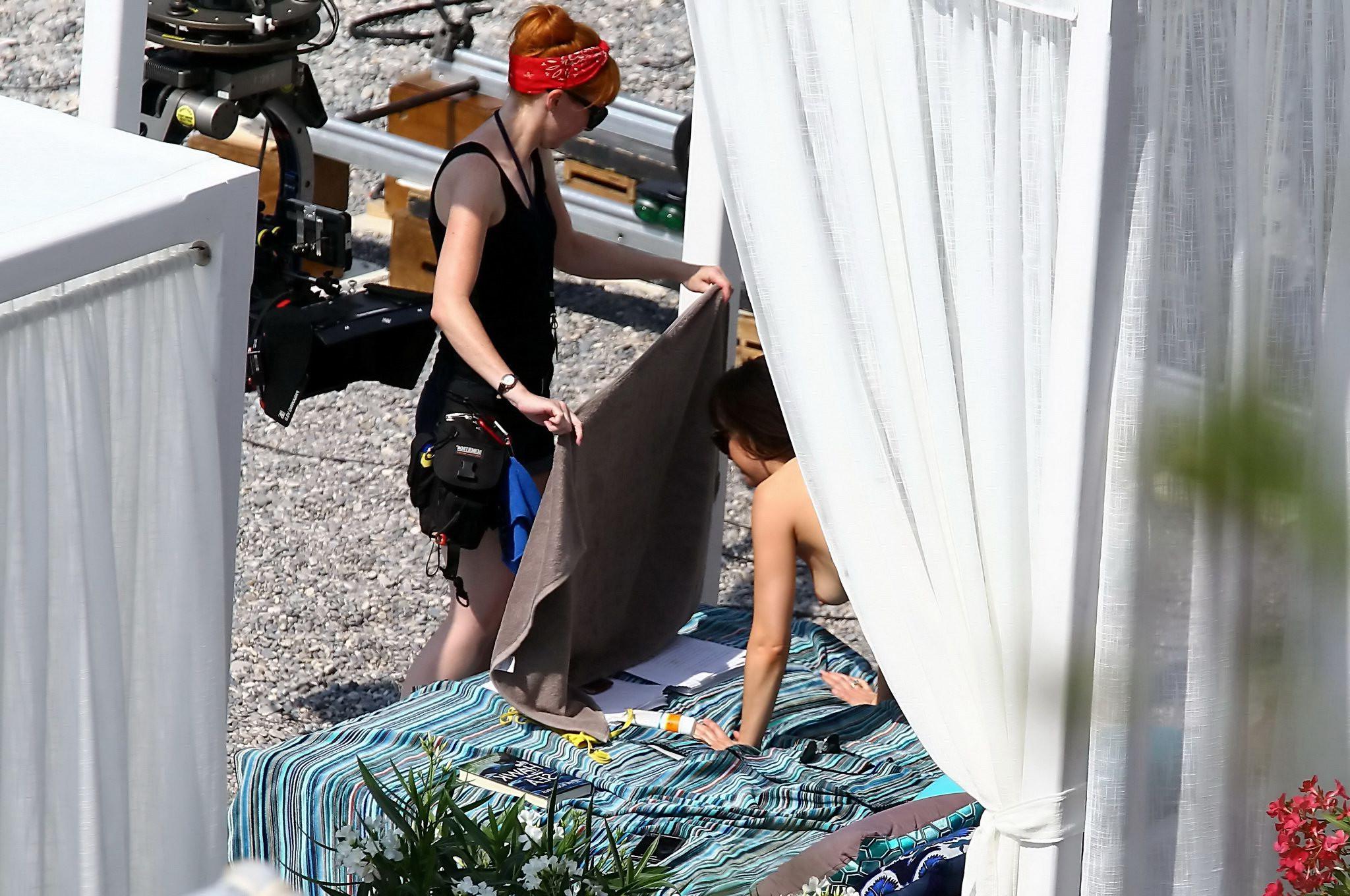 16P Dakota Johnson topless at the beach during a movie set