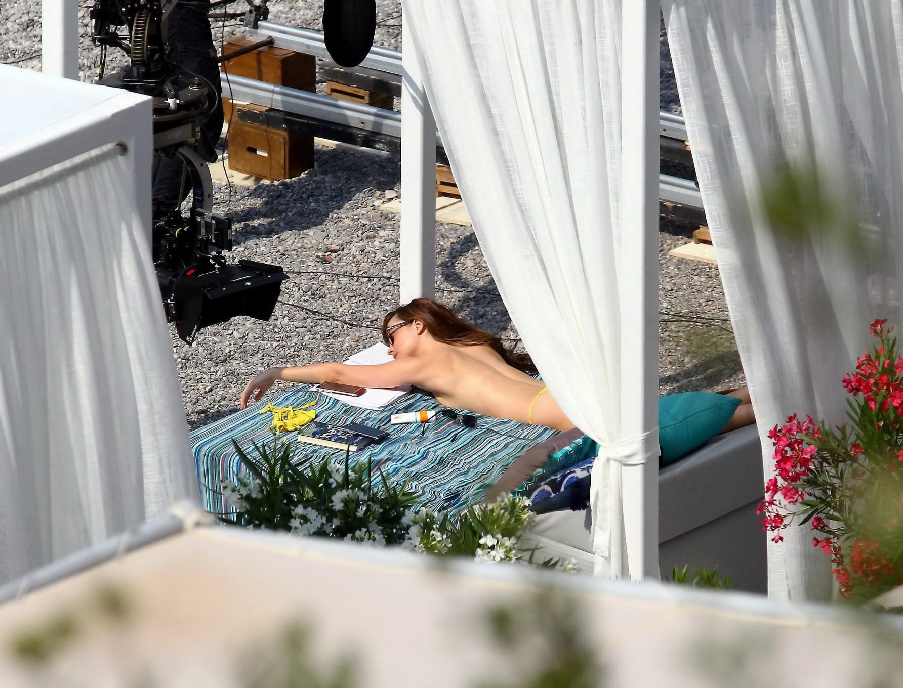 16P Dakota Johnson topless at the beach during a movie set
