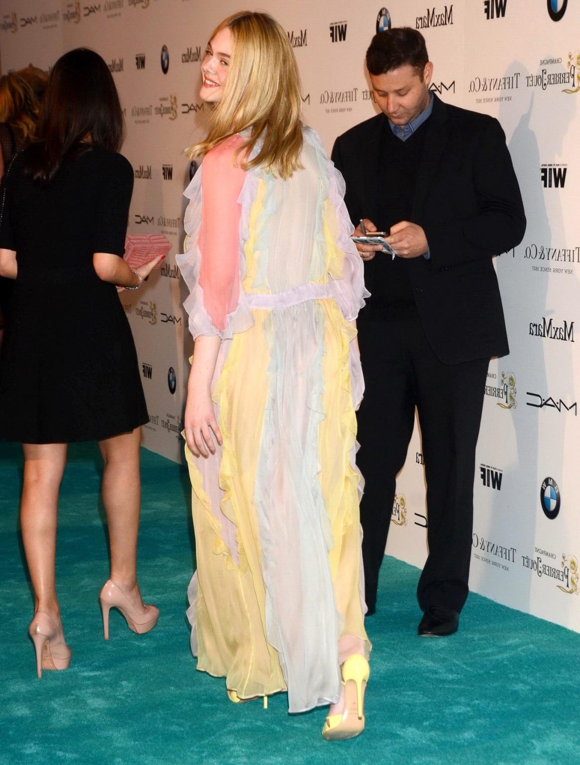 16P Elle Fanning braless wearing a sexy dress at the 8th Annual Women in Film PreOsc