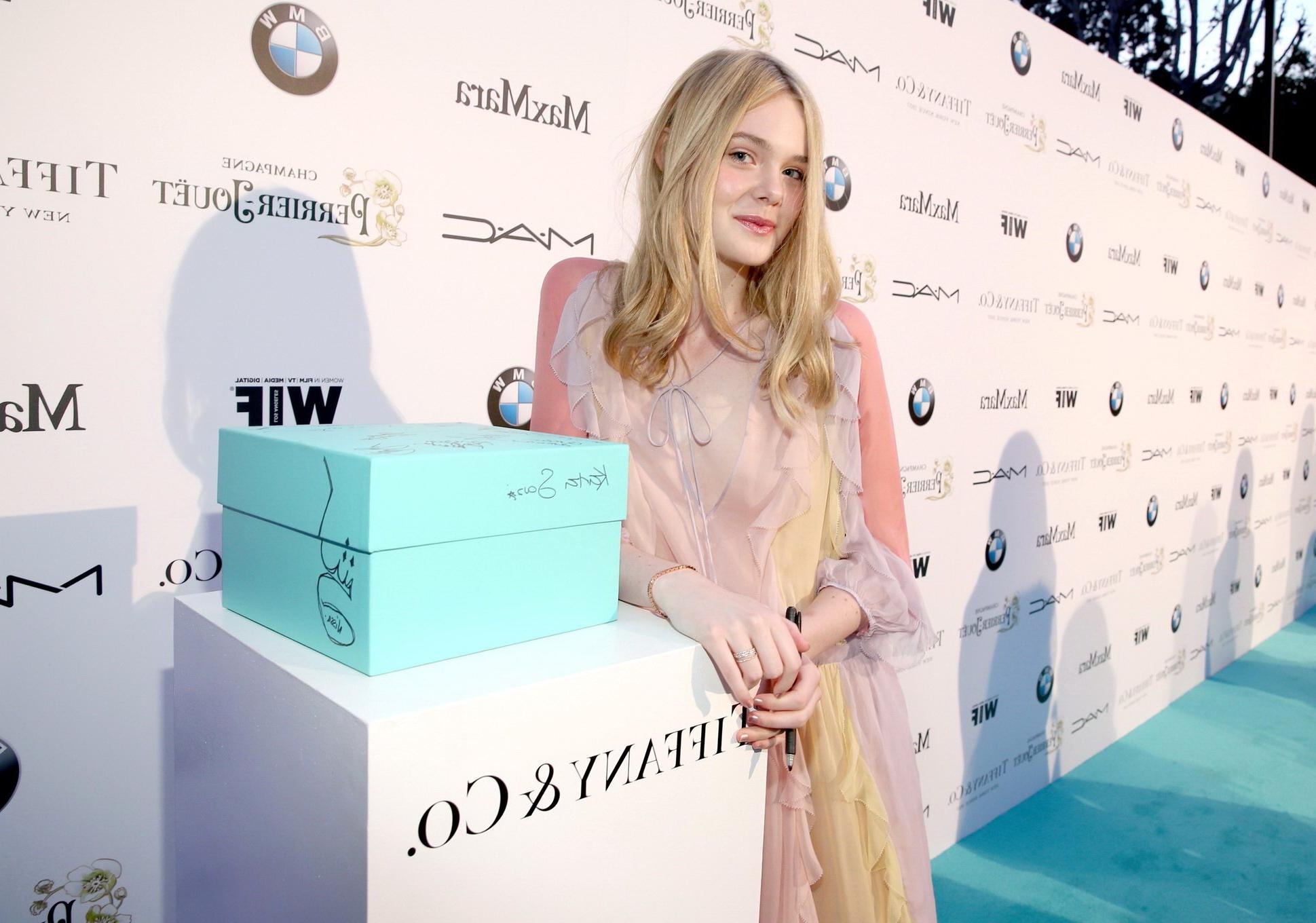 16P Elle Fanning braless wearing a sexy dress at the 8th Annual Women in Film PreOsc