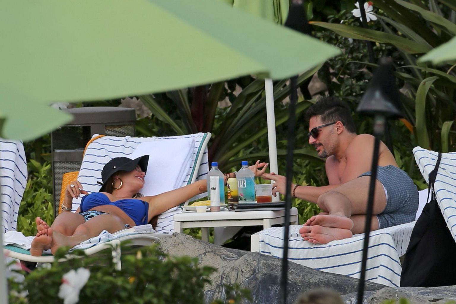 16P Sofia Vergara busty wearing skimpy blue twopiece during a vacation in Hawaii