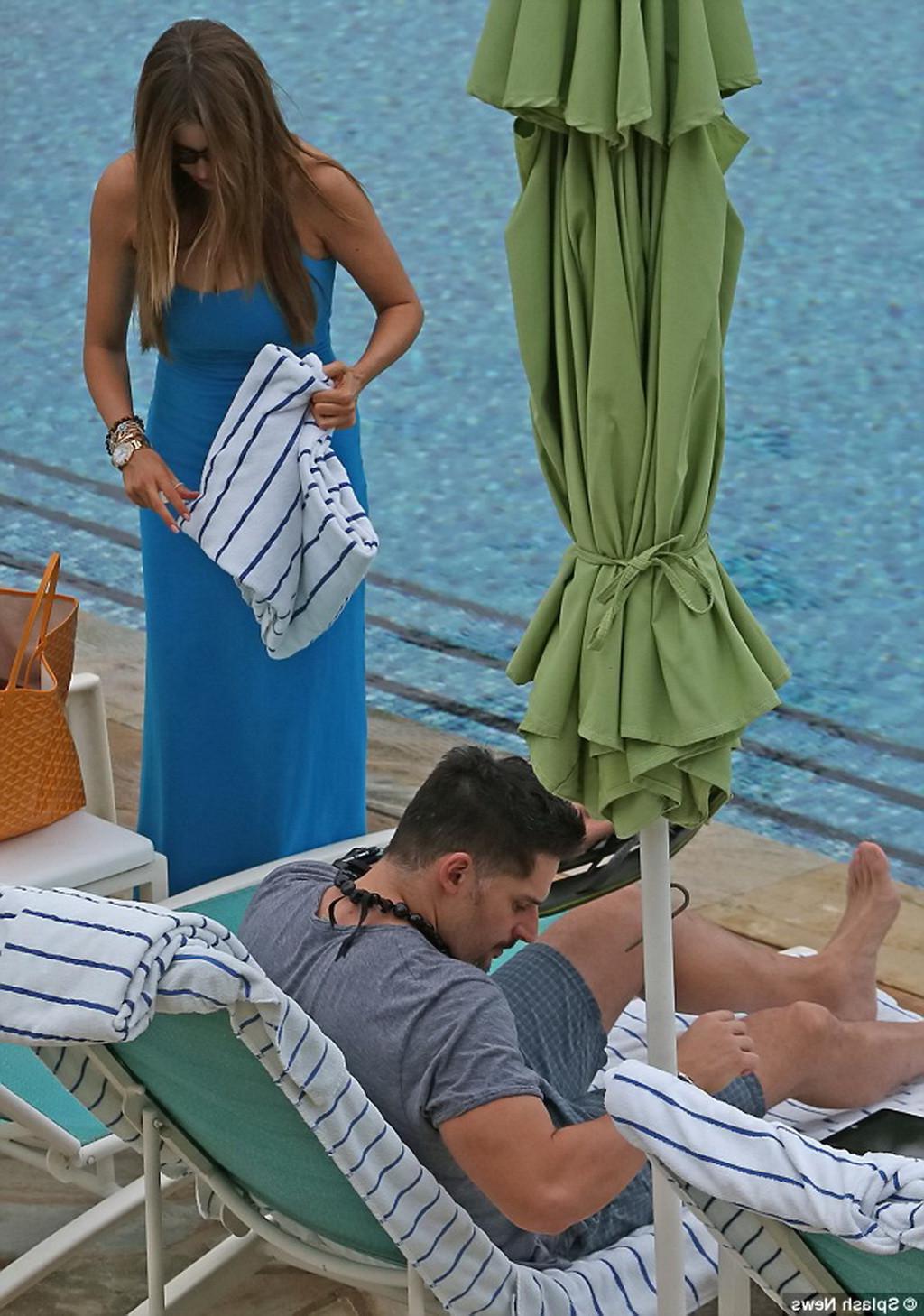 16P Sofia Vergara busty wearing skimpy blue twopiece during a vacation in Hawaii