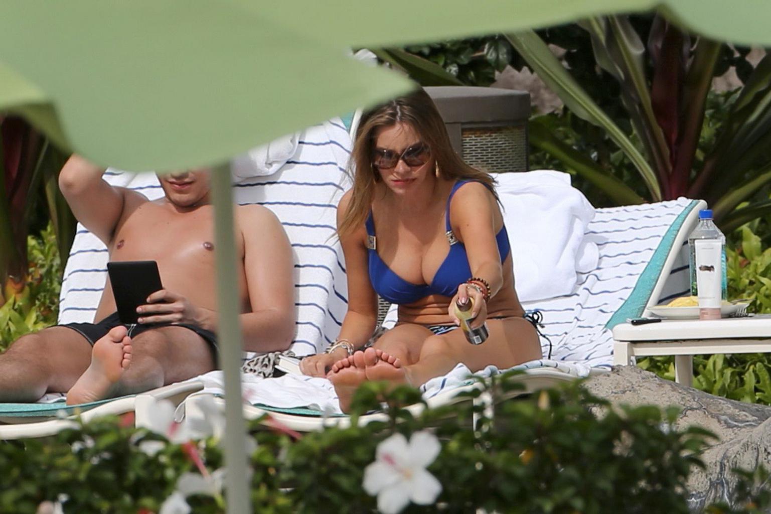 16P Sofia Vergara busty wearing skimpy blue twopiece during a vacation in Hawaii