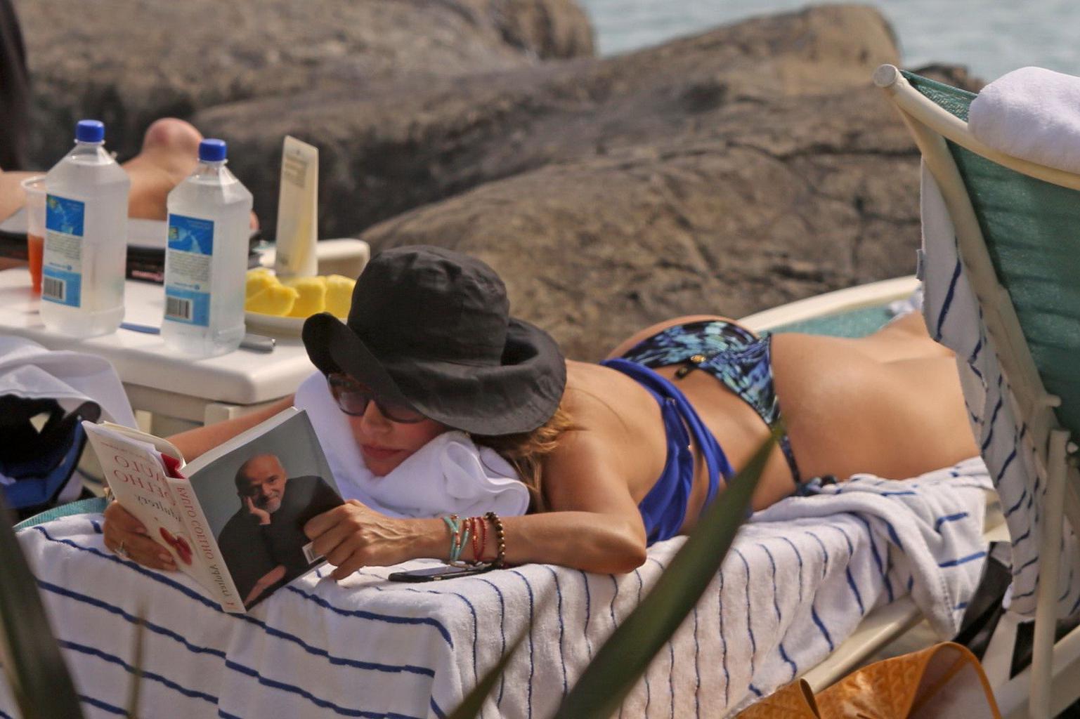 16P Sofia Vergara busty wearing skimpy blue twopiece during a vacation in Hawaii