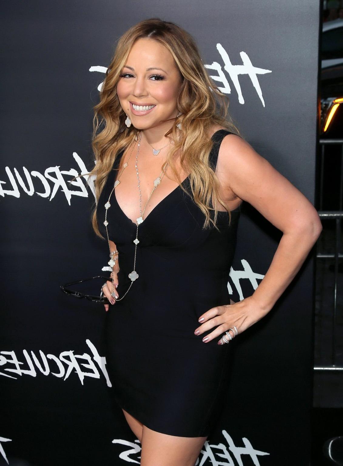 16P Mariah Carey leggy and cleavy wearing a little black dress for the Hercules prem