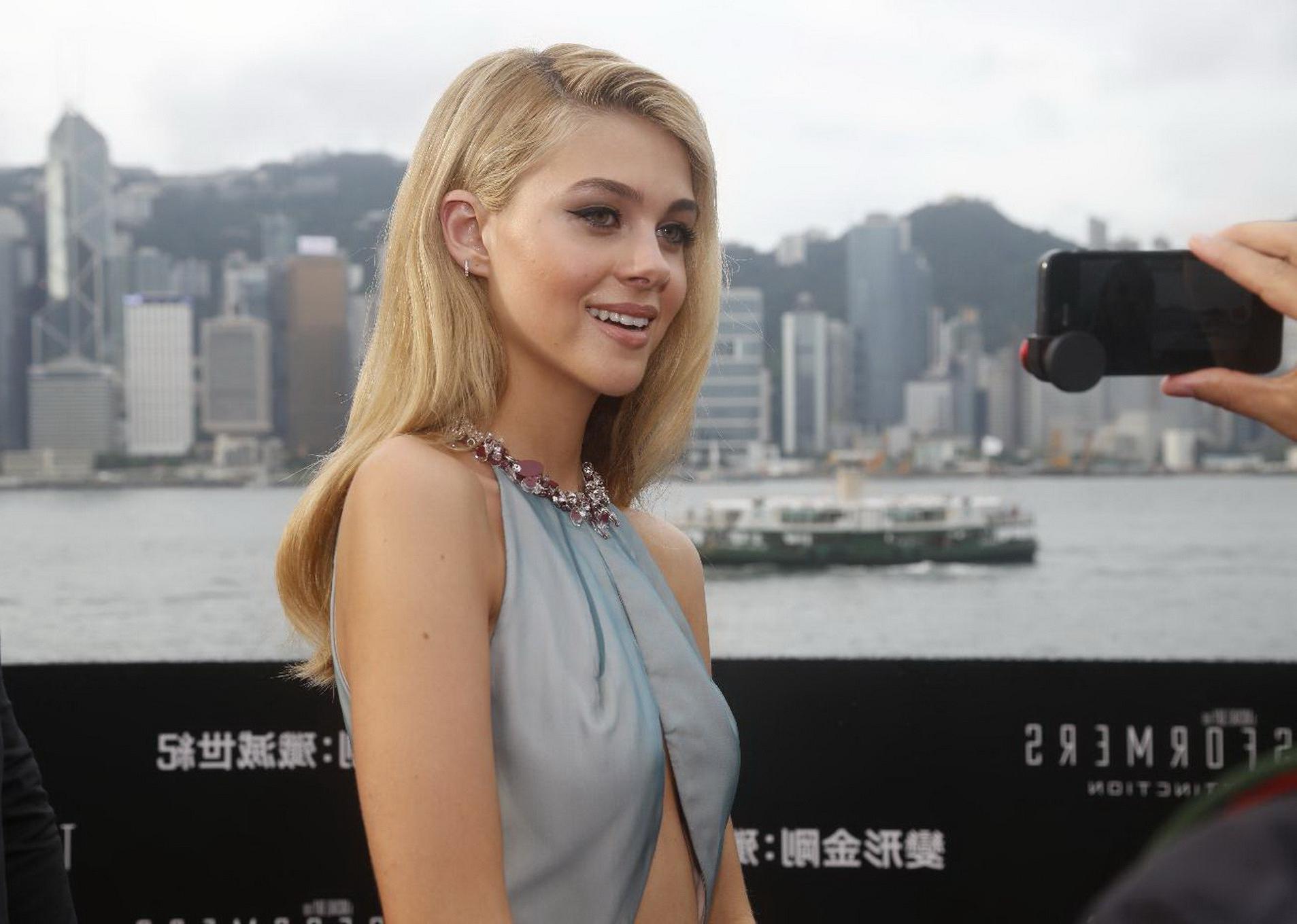 16P Nicola Peltz shows off her big boobs braless in revealing gray dress at the film