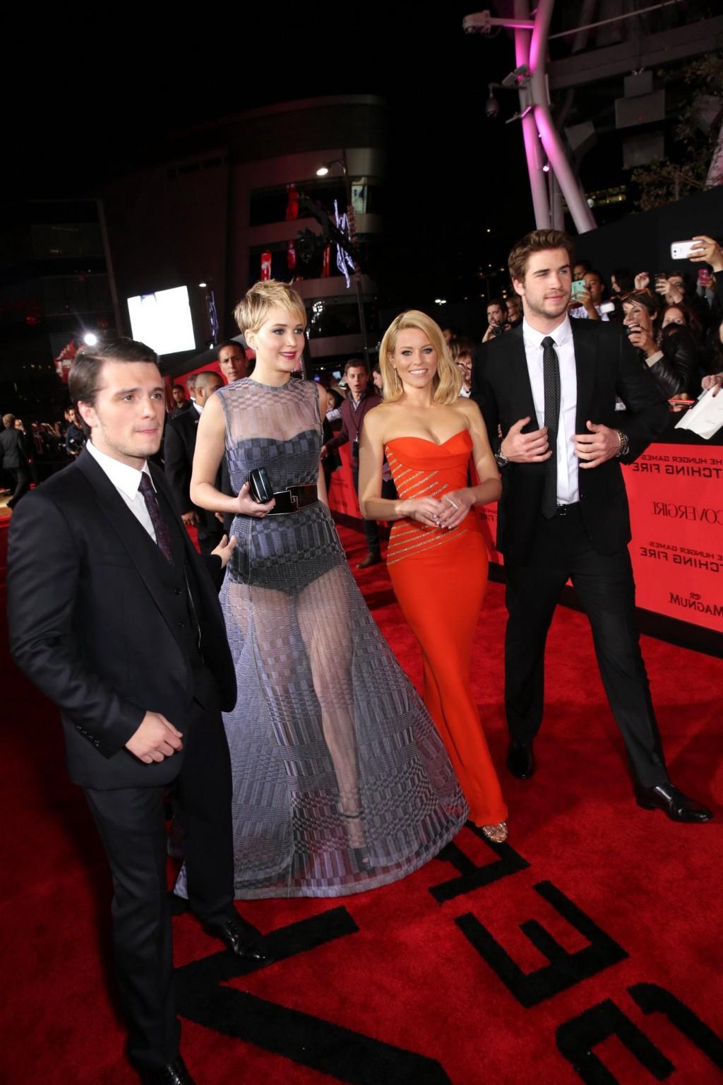 16P Elizabeth Banks cleavy wearing tight tube orange dress at The Hunger Games:Catch