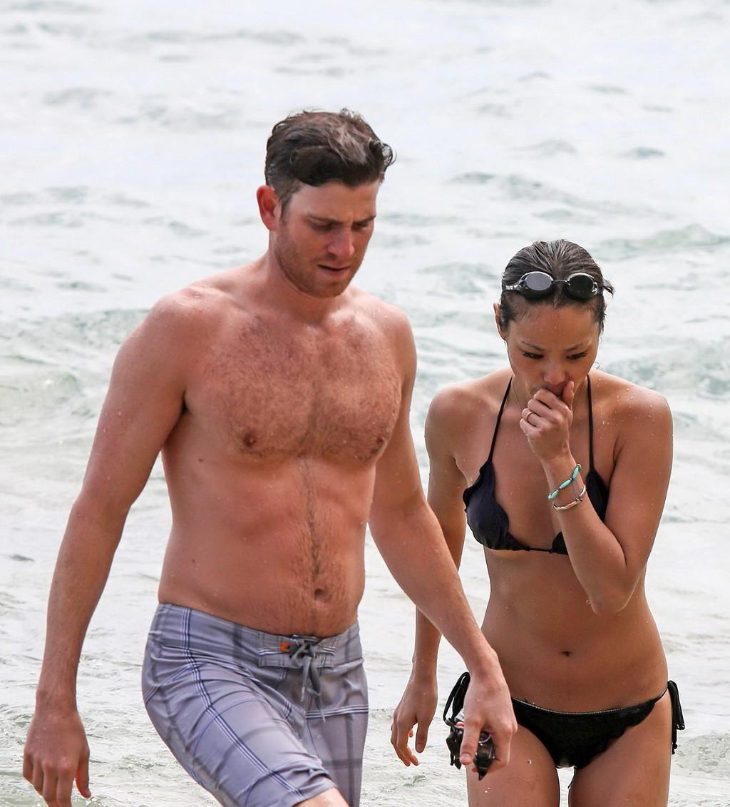 16P Jamie Chung wearing tiny wet bikini at the beach during a vacation in Hawaii