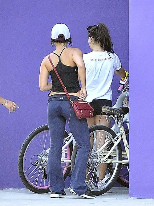 16P Vanessa Hudgens riding bike and exposing sexy ass in tight pants