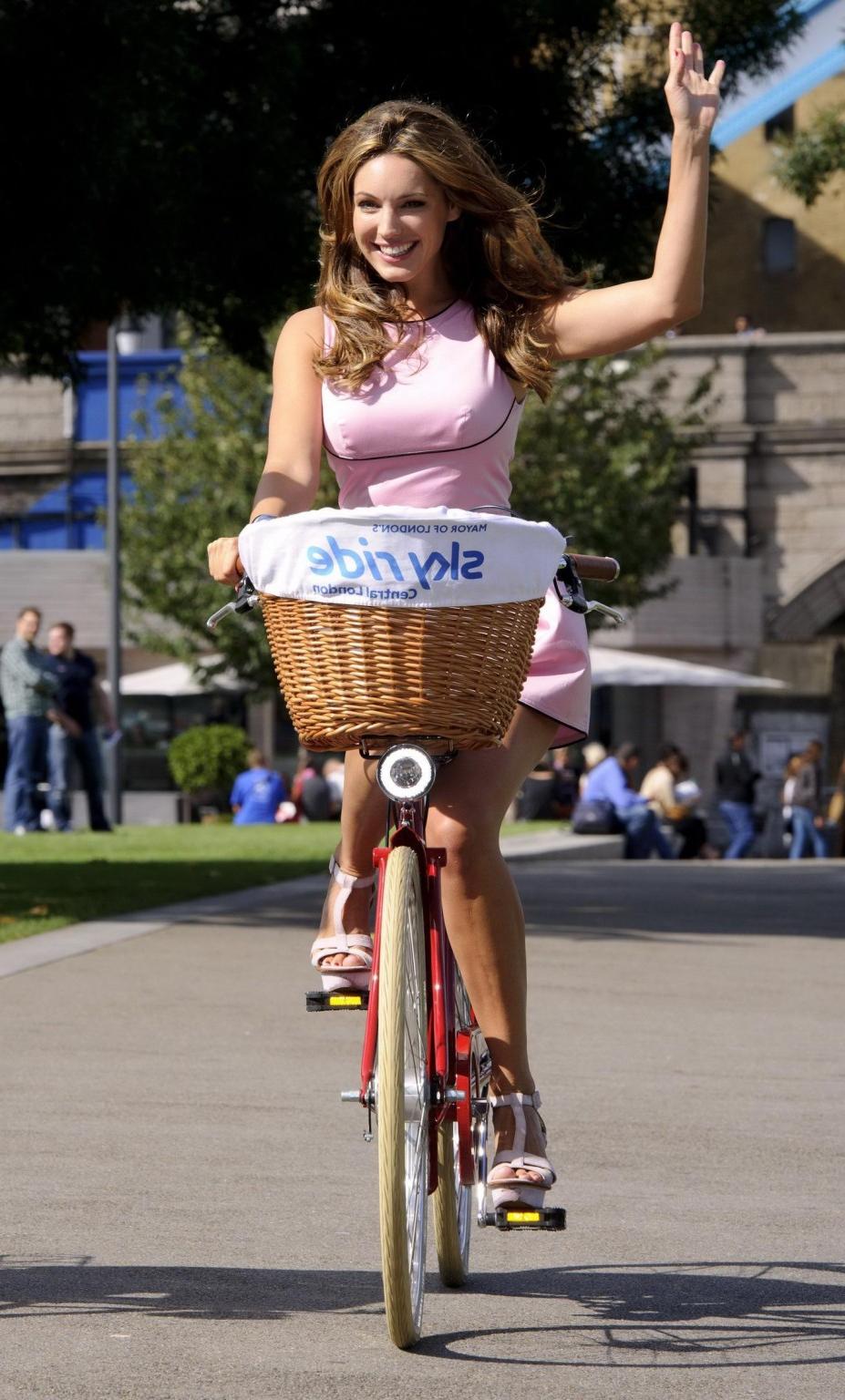 16P Kelly Brook riding a cycle in mini dress for the launch of London's Skyride