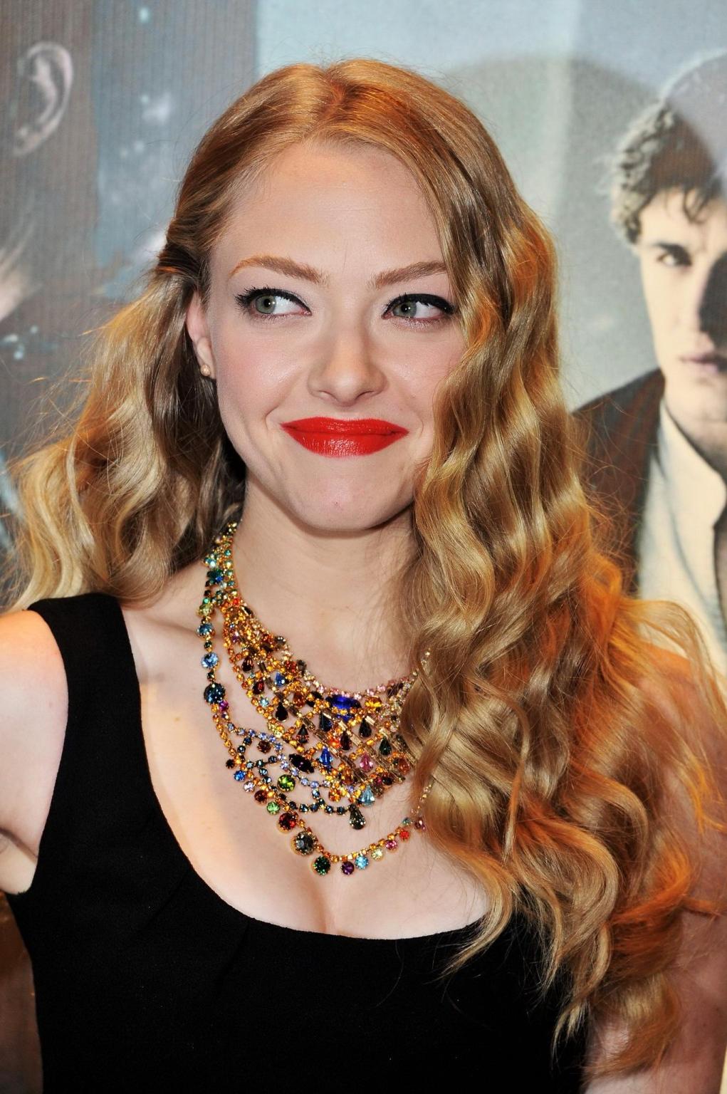 16P Amanda Seyfried leggy wearing little black dress at the 'Red Riding Hood' screen