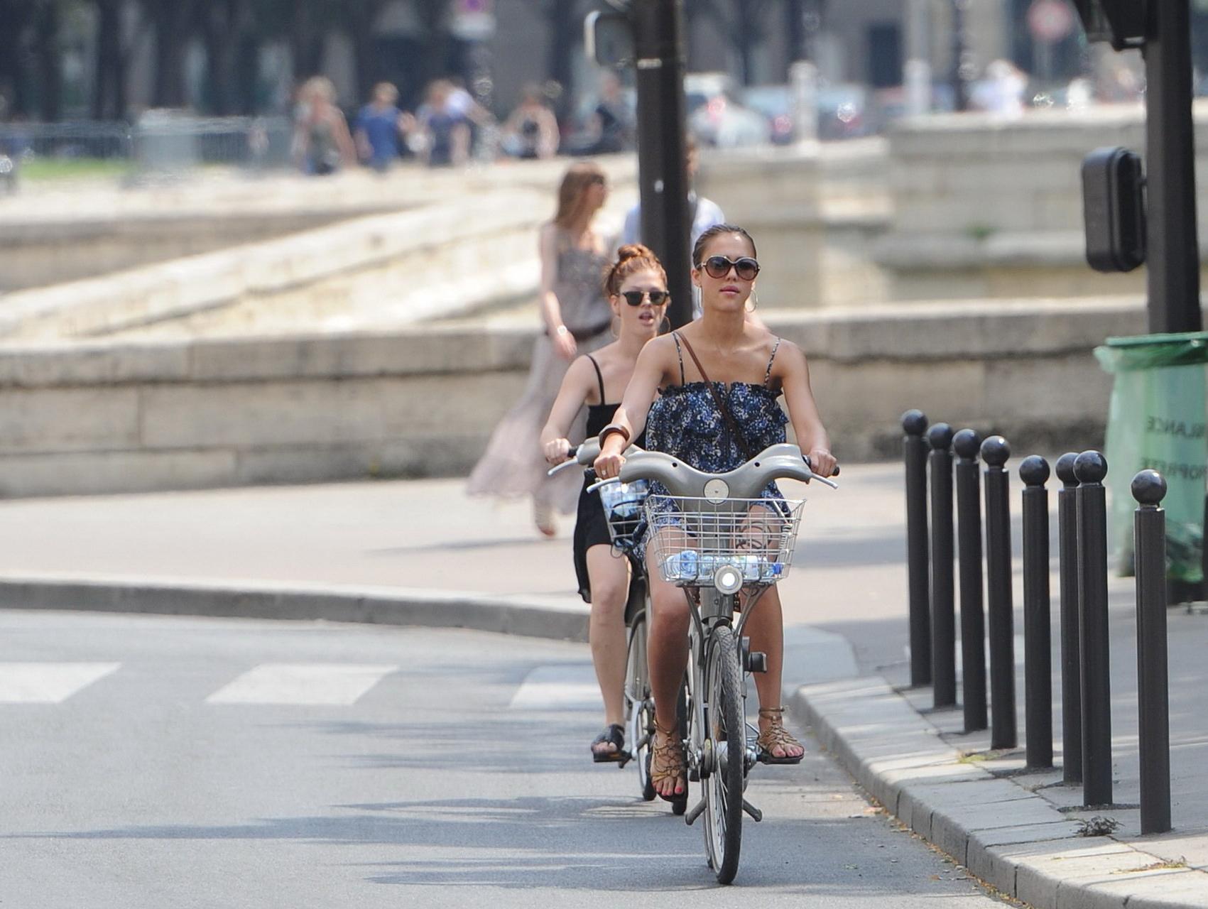 16P Jessica Alba leggy in Paris - riding a bike in mini dress