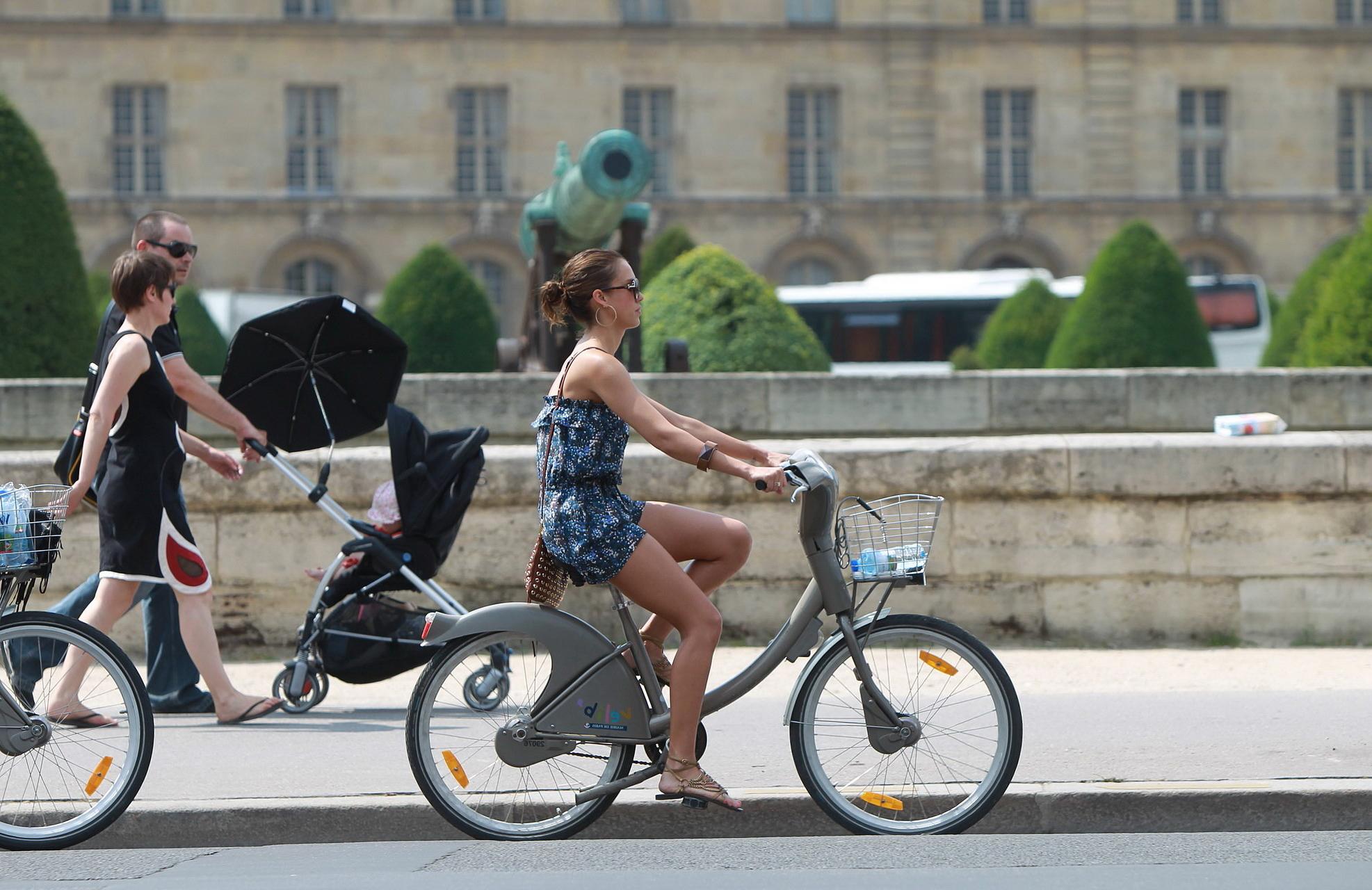 16P Jessica Alba leggy in Paris - riding a bike in mini dress