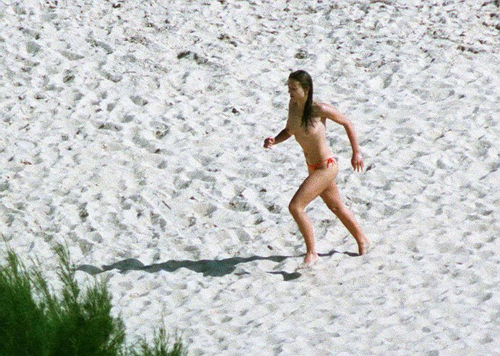 10P Elizabeth Hurley exposing her nice big tits on beach during vacation paparazzi p
