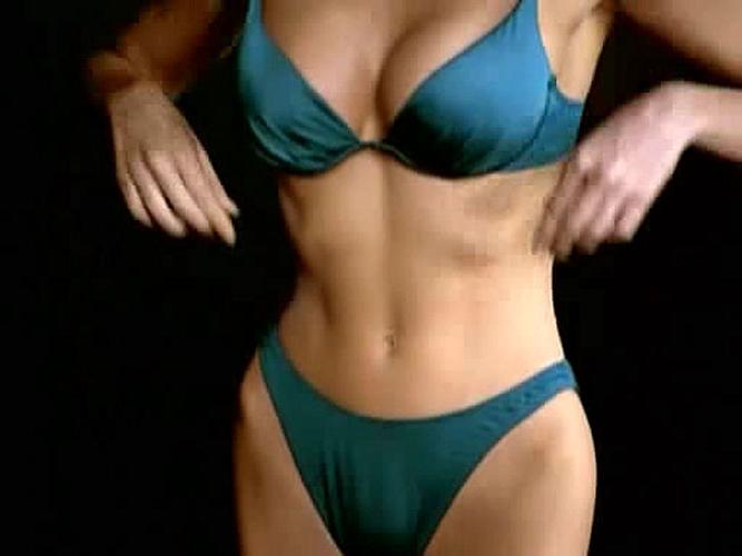 15P Simmone MacKinnon looking very sexy in bikini in some movie caps