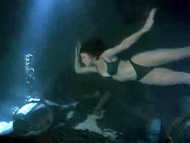 15P Simmone MacKinnon looking very sexy in bikini in some movie caps