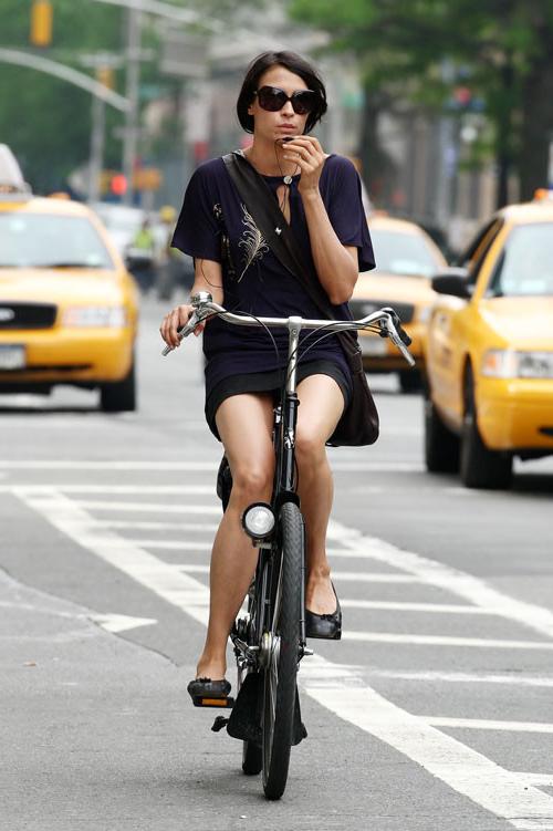 16P Famke Janssen showing her panties while riding bike paparazzi pictures and posin