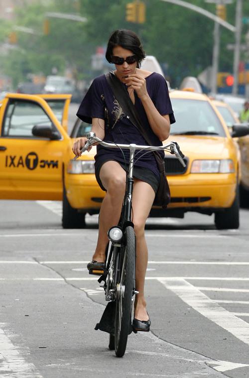 16P Famke Janssen showing her panties while riding bike paparazzi pictures and posin