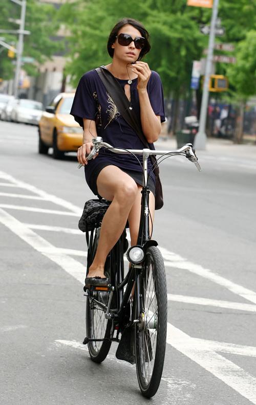 16P Famke Janssen showing her panties while riding bike paparazzi pictures and posin