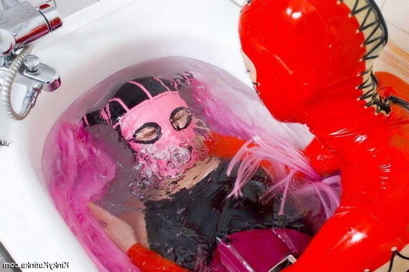 16P Two girls in latex taking a bath