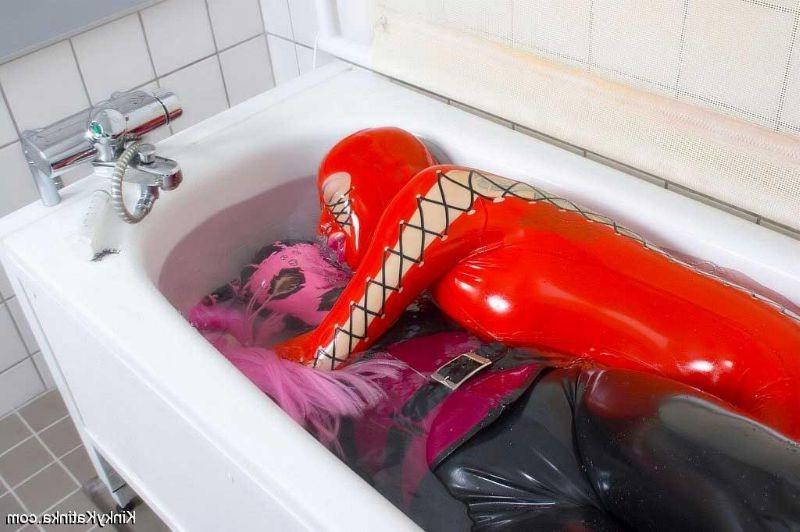 16P Two girls in latex taking a bath