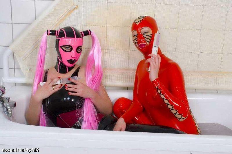 16P Two girls in latex taking a bath