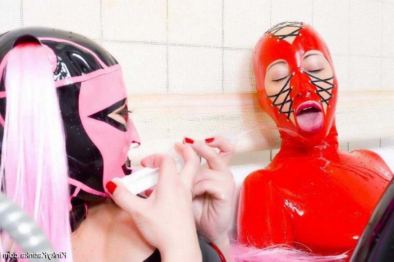 16P Two girls in latex taking a bath