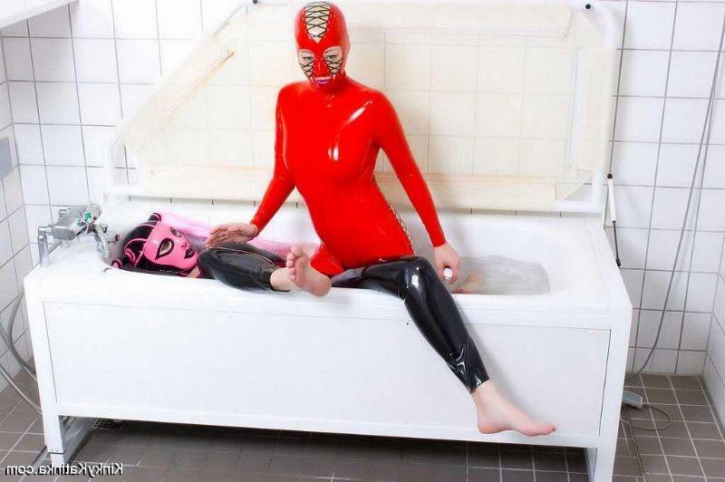 16P Two girls in latex taking a bath