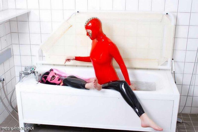 16P Two girls in latex taking a bath
